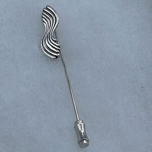Vintage Sarah Coventry silver tone wave stick pin.
